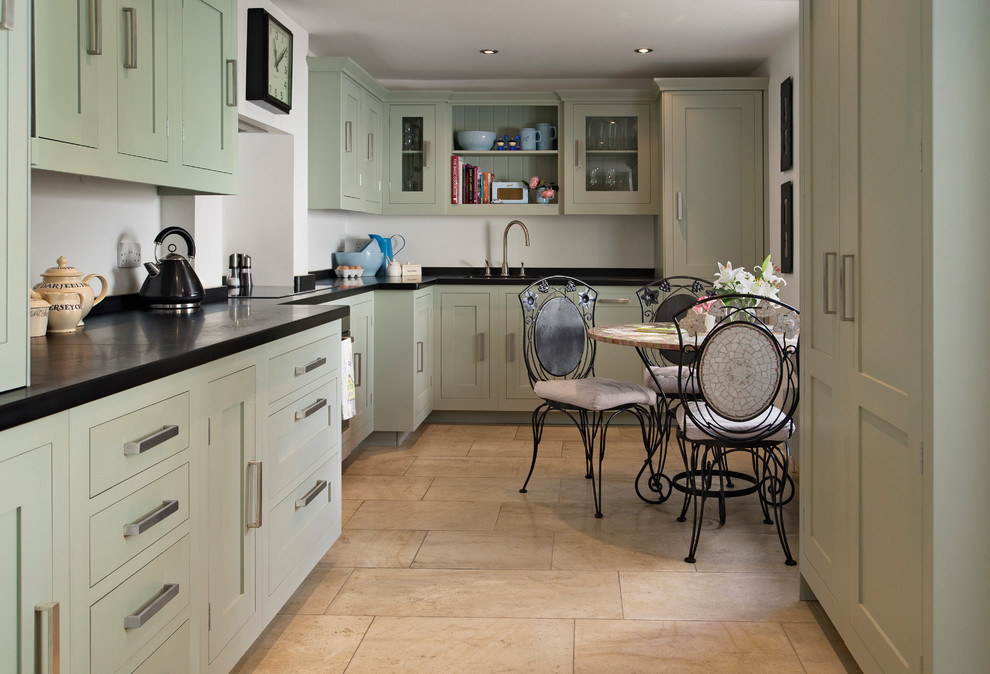 Photo of a transitional separate kitchen in Cardiff with shaker cabinets, green cabinets and no island.