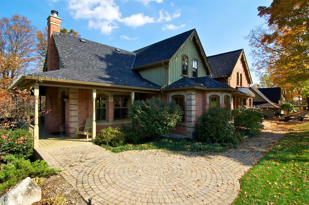 This is an example of a country two-storey exterior in Toronto with mixed siding and a gable roof.