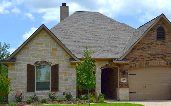 This is an example of a traditional one-storey exterior in Austin with stone veneer.