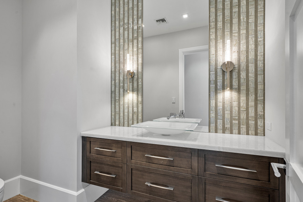 Inspiration for a medium sized classic shower room bathroom in Miami with beaded cabinets, brown cabinets, a one-piece toilet, grey walls, dark hardwood flooring, a vessel sink, quartz worktops, brown floors, white worktops, a single sink, a floating vanity unit and wallpapered walls.