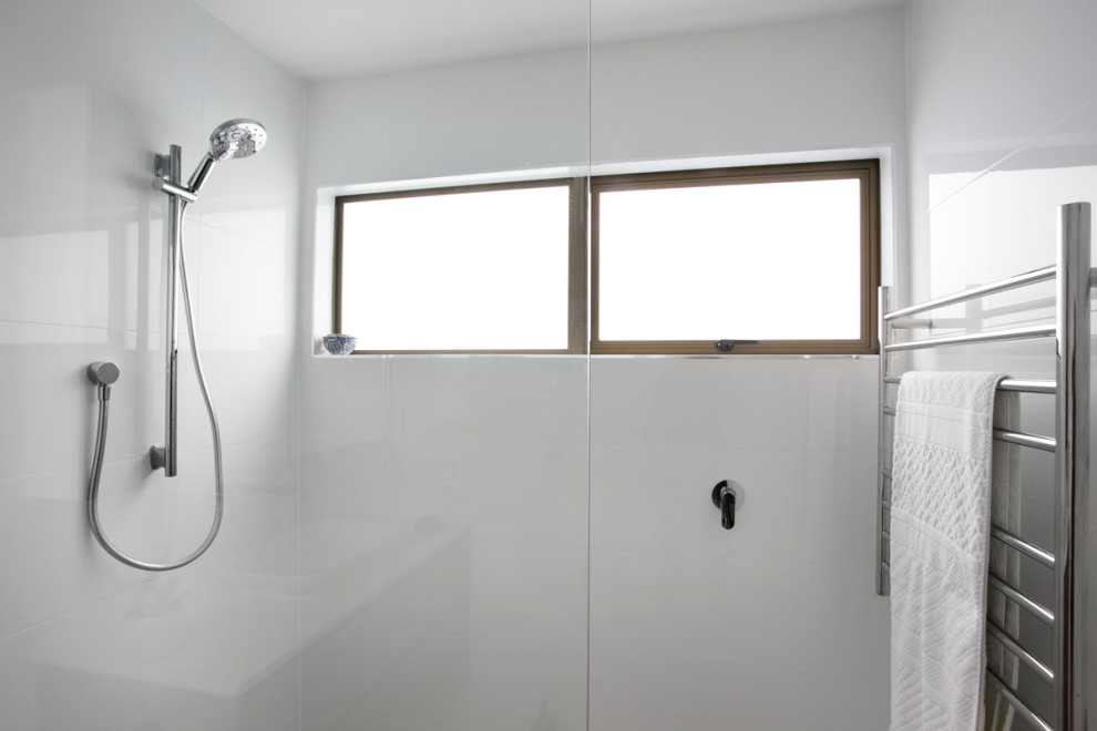 Medium sized contemporary bathroom in Brisbane with a walk-in shower, white tiles, ceramic tiles, white walls, ceramic flooring, an open shower, all types of ceiling and all types of wall treatment.