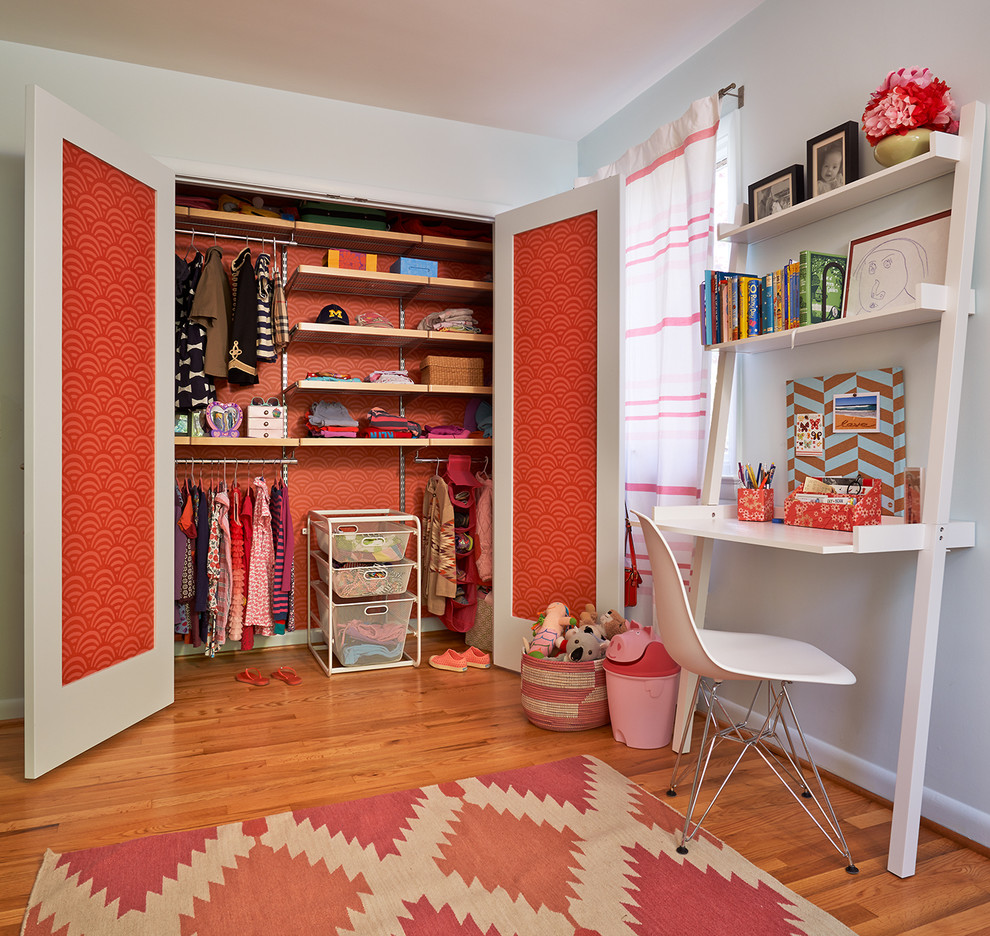 Inspiration for a mid-sized 1960s guest light wood floor and beige floor bedroom remodel in DC Metro with white walls and no fireplace