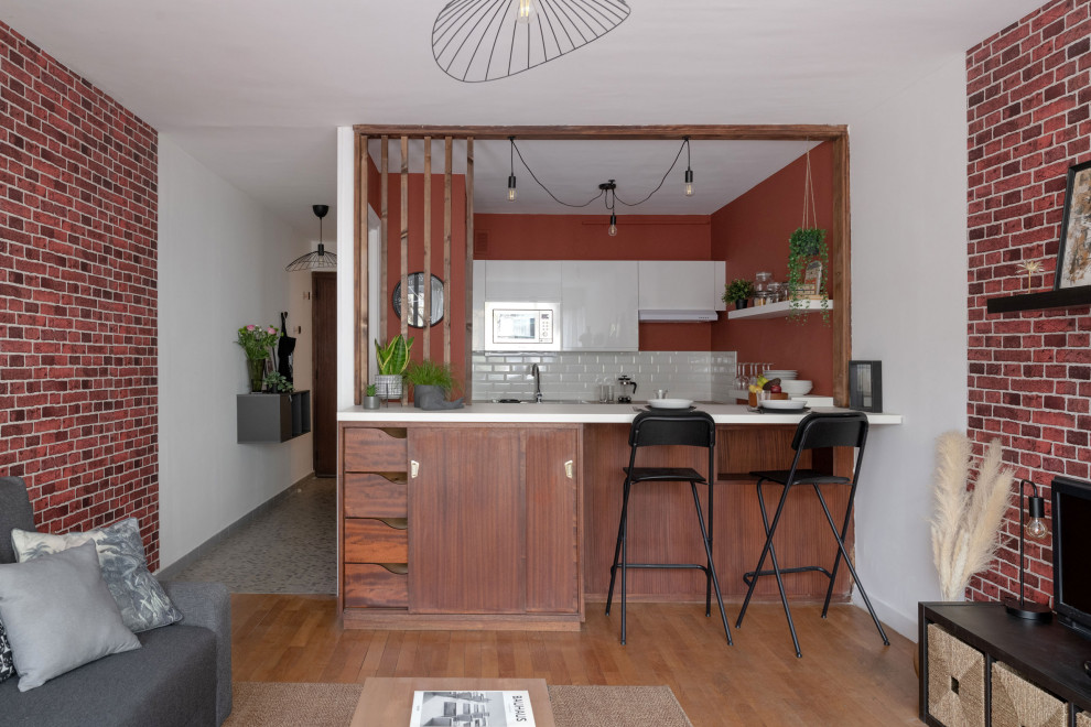 Design ideas for a medium sized industrial single-wall kitchen/diner in Lyon with beige floors, a coffered ceiling, a submerged sink, beaded cabinets, medium wood cabinets, wood worktops, white splashback, metro tiled splashback, white appliances, laminate floors, an island and beige worktops.