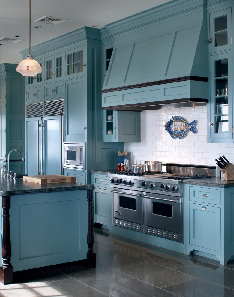 Inspiration for a beach style kitchen in Boston with recessed-panel cabinets, blue cabinets, red splashback, stainless steel appliances, with island and green benchtop.