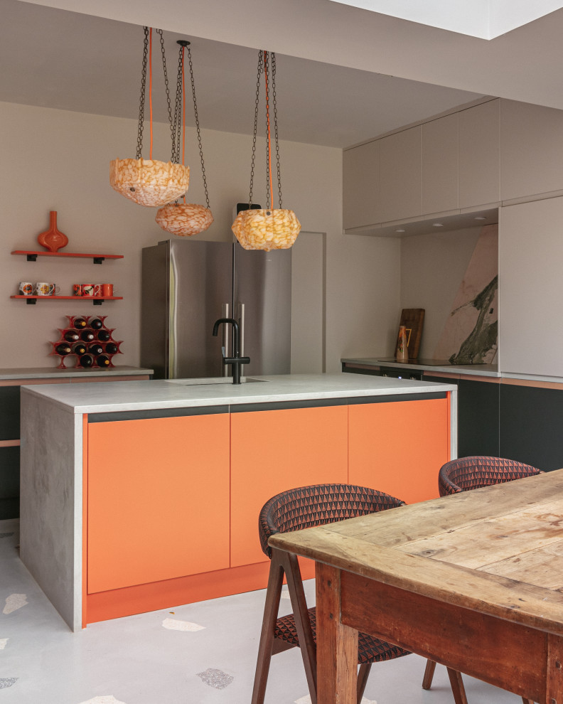 Inspiration for a large midcentury open plan kitchen in London with a single-bowl sink, with island, grey floor, grey benchtop, flat-panel cabinets, beige splashback, terrazzo floors and orange cabinets.