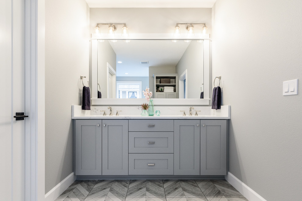 Inspiration for a transitional bathroom in Portland with shaker cabinets, grey cabinets, grey walls, an undermount sink, grey floor and white benchtops.