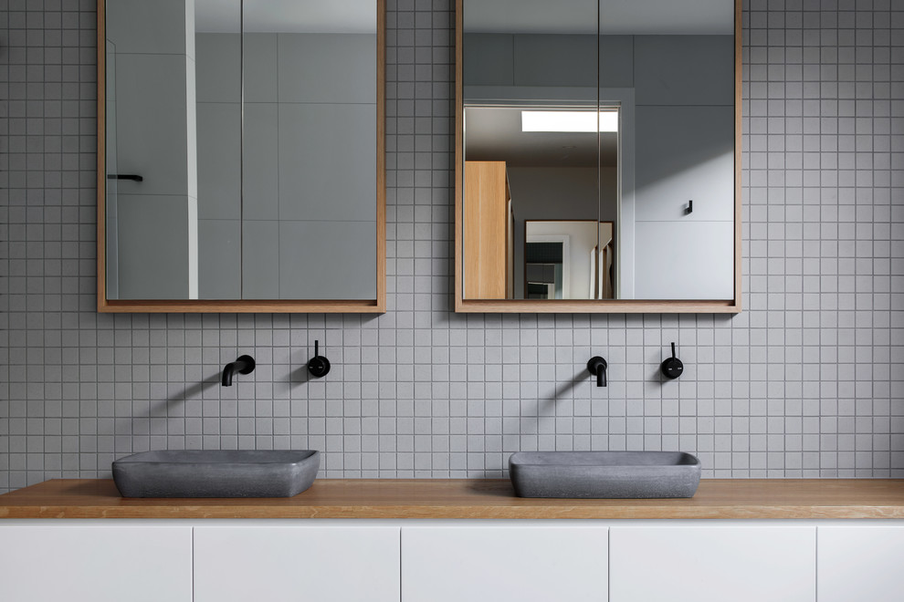 Contemporary bathroom in Canberra - Queanbeyan with gray tile.