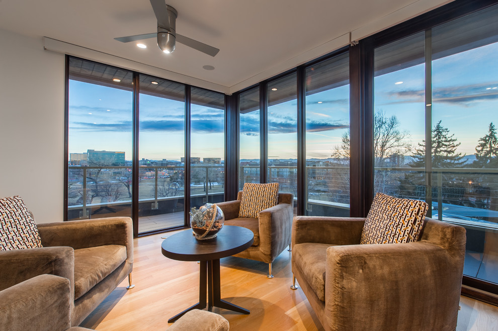 Mid-sized modern sunroom in Denver with light hardwood floors, a standard ceiling and no fireplace.
