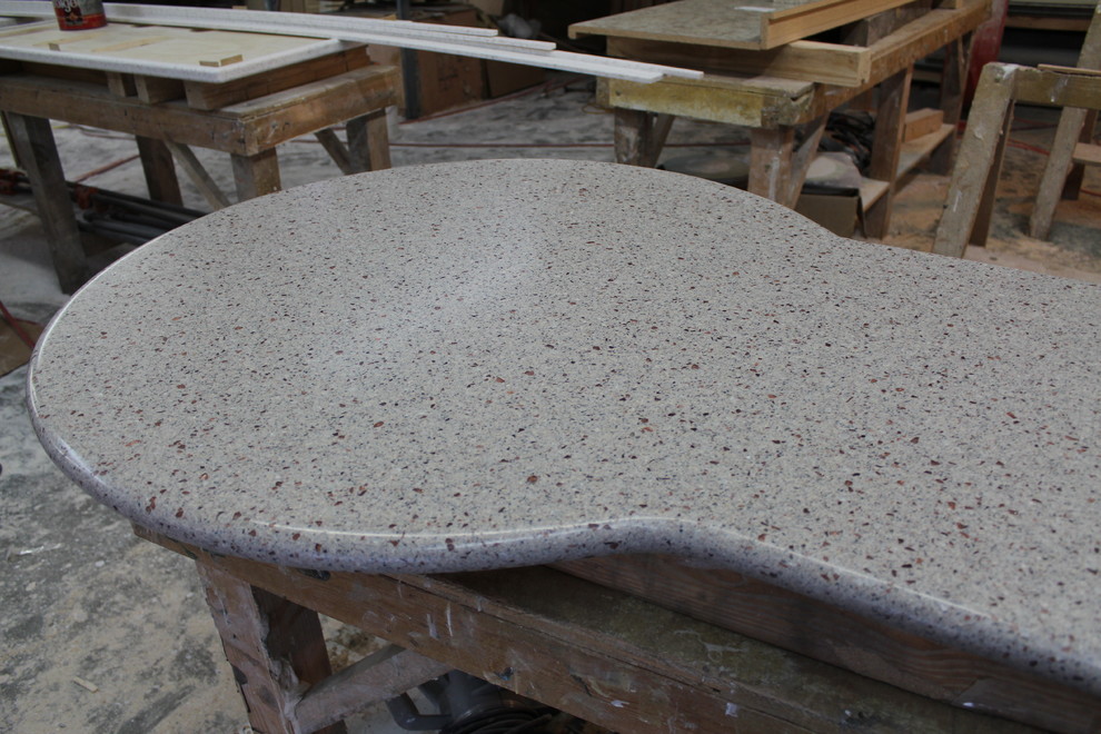 Inspiration for a contemporary kitchen remodel with solid surface countertops