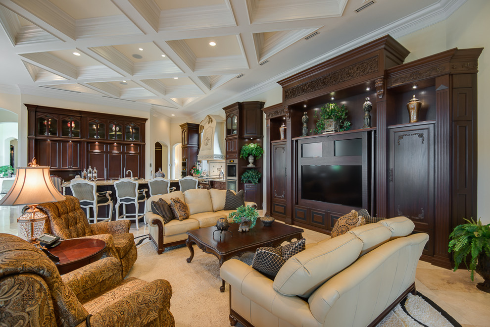 Inspiration for a traditional open concept family room in Miami with beige walls and a built-in media wall.