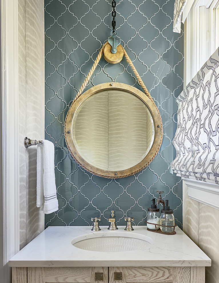 Inspiration for an eclectic powder room in Charlotte with blue tile, glass tile, an undermount sink, quartzite benchtops and white benchtops.