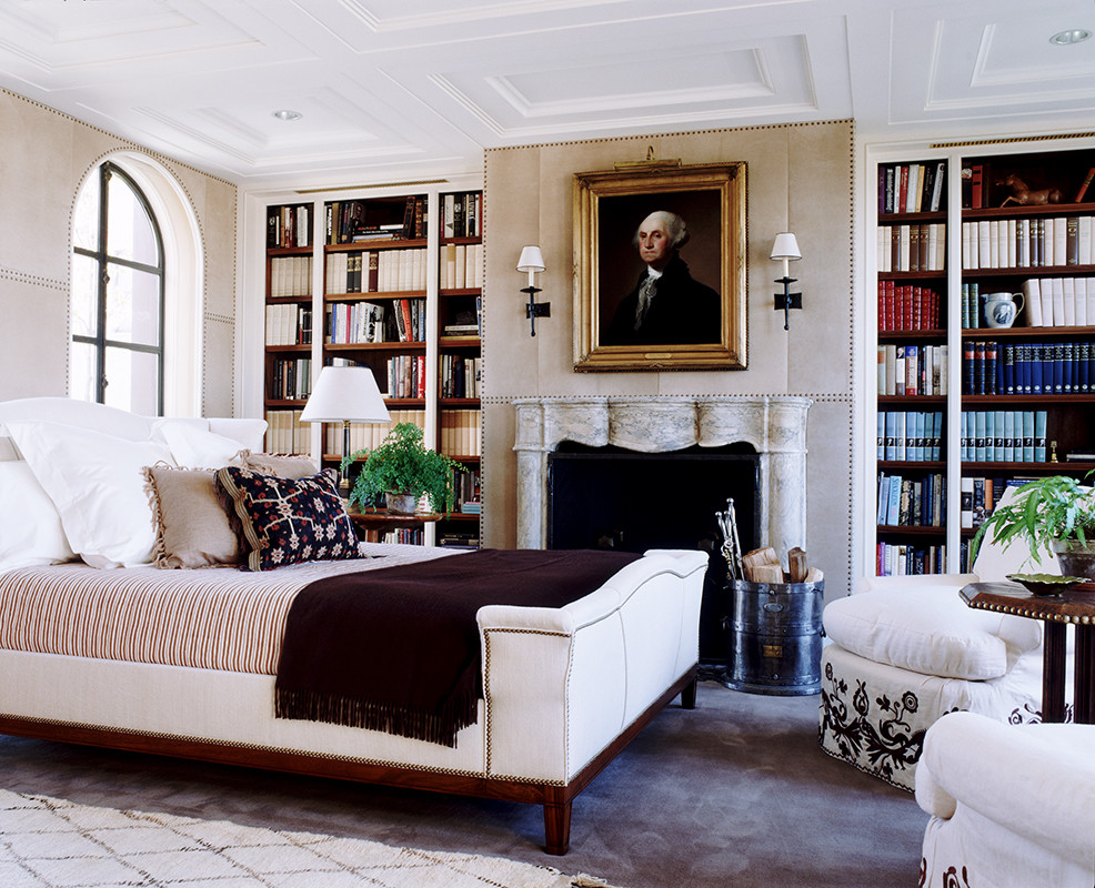 Large elegant master dark wood floor bedroom photo in New York with gray walls, a standard fireplace and a stone fireplace