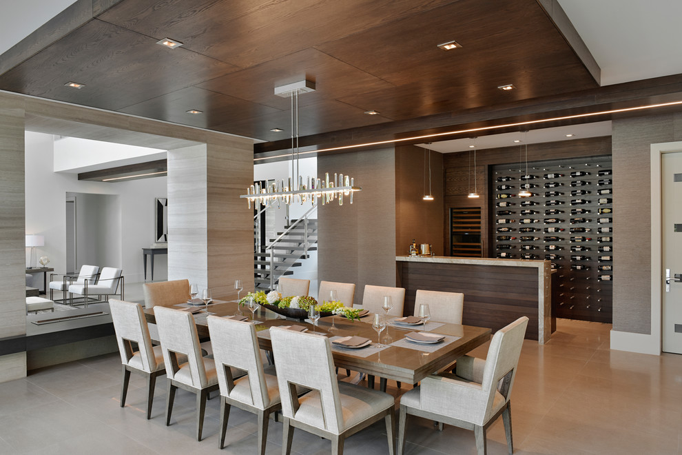 Photo of a contemporary open plan dining in Miami with brown walls, no fireplace and beige floor.