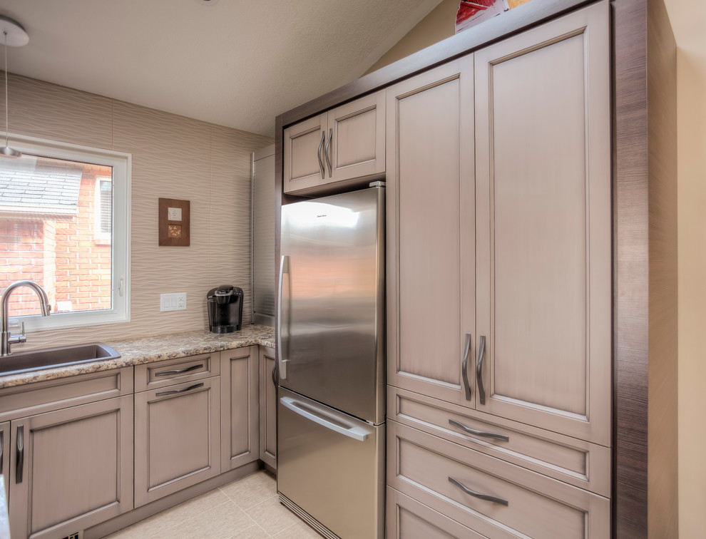 Example of a transitional ceramic tile open concept kitchen design in Toronto with a single-bowl sink, flat-panel cabinets, brown cabinets, laminate countertops, beige backsplash, ceramic backsplash, stainless steel appliances and an island