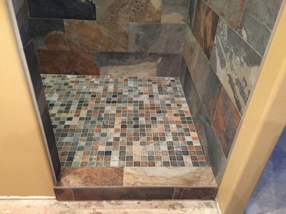 Large traditional master bathroom in Portland with multi-coloured tile, beige walls and slate floors.