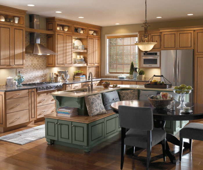 Inspiration for a large transitional galley eat-in kitchen in Denver with an undermount sink, raised-panel cabinets, medium wood cabinets, quartz benchtops, beige splashback, ceramic splashback, stainless steel appliances, medium hardwood floors and with island.