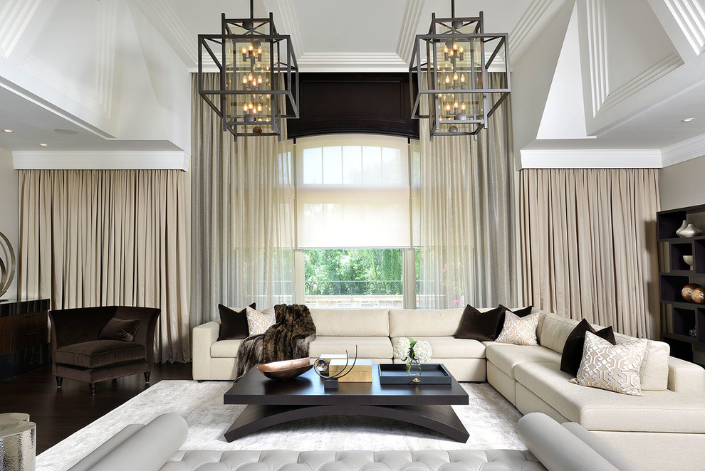 Inspiration for a contemporary family room in Toronto with beige walls and dark hardwood floors.