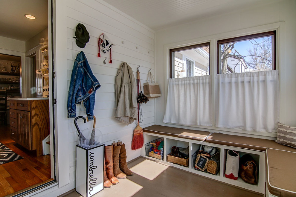 Inspiration for a small mudroom in Other with white walls and painted wood floors.