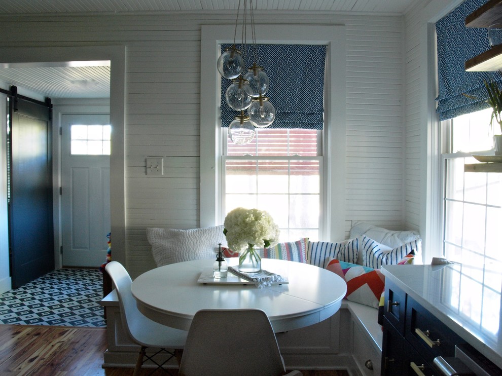 This is an example of a small beach style dining room in Charleston.