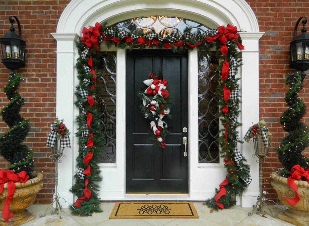 Example of a classic entryway design in Atlanta with a black front door