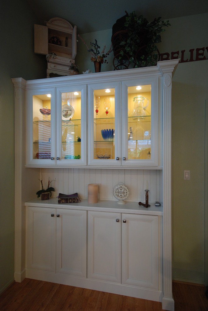 Transitional kitchen photo with flat-panel cabinets and white cabinets