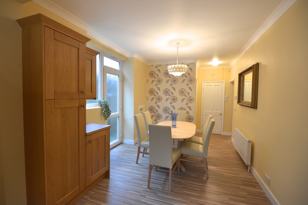 This is an example of a transitional dining room in Cambridgeshire.