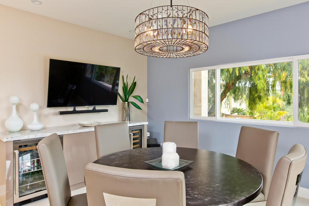 Photo of a mid-sized contemporary open plan dining in San Diego with porcelain floors.