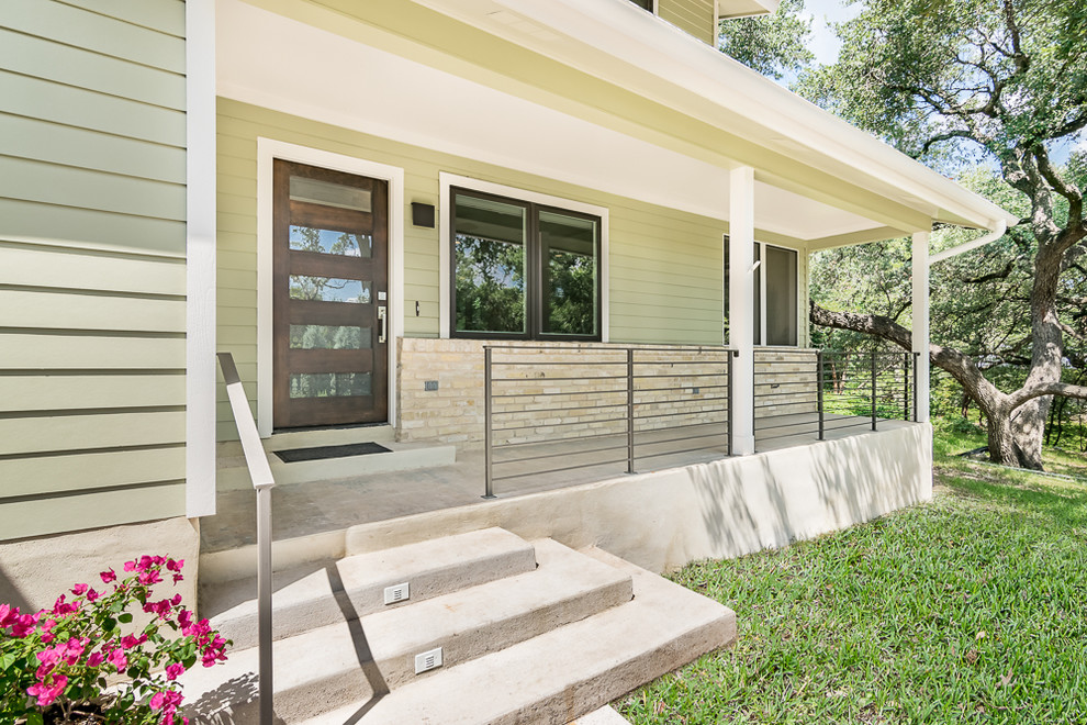 Example of a transitional home design design in Austin