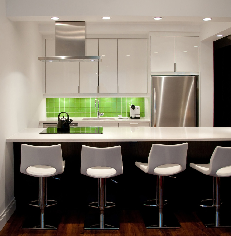 Design ideas for a small contemporary single-wall eat-in kitchen in San Francisco with white cabinets, green splashback, stainless steel appliances, with island, an undermount sink, flat-panel cabinets, quartz benchtops, ceramic splashback, dark hardwood floors and brown floor.
