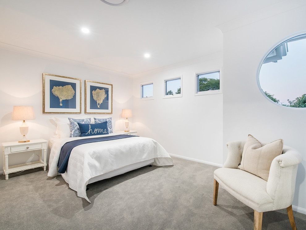 Design ideas for a mid-sized beach style guest bedroom in Brisbane with white walls, carpet and grey floor.