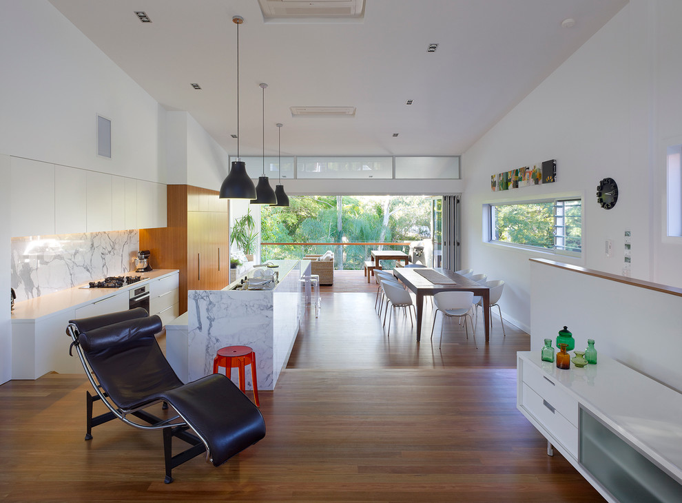 Contemporary open concept living room in Brisbane with white walls, medium hardwood floors, no fireplace and no tv.