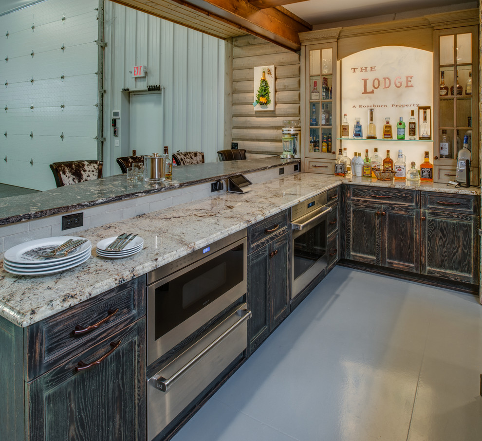 Eat-in kitchen - rustic u-shaped concrete floor eat-in kitchen idea with a farmhouse sink, distressed cabinets, granite countertops, stainless steel appliances, white backsplash, subway tile backsplash, recessed-panel cabinets and an island
