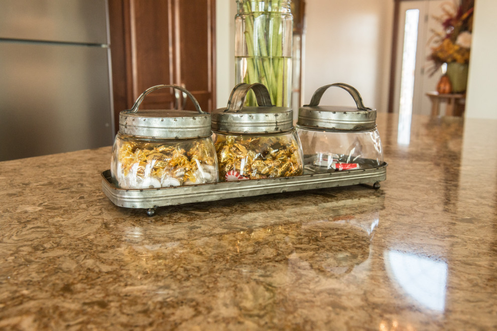 Open concept kitchen - large transitional l-shaped medium tone wood floor open concept kitchen idea with an undermount sink, flat-panel cabinets, medium tone wood cabinets, quartz countertops, white backsplash, ceramic backsplash, stainless steel appliances, an island and multicolored countertops