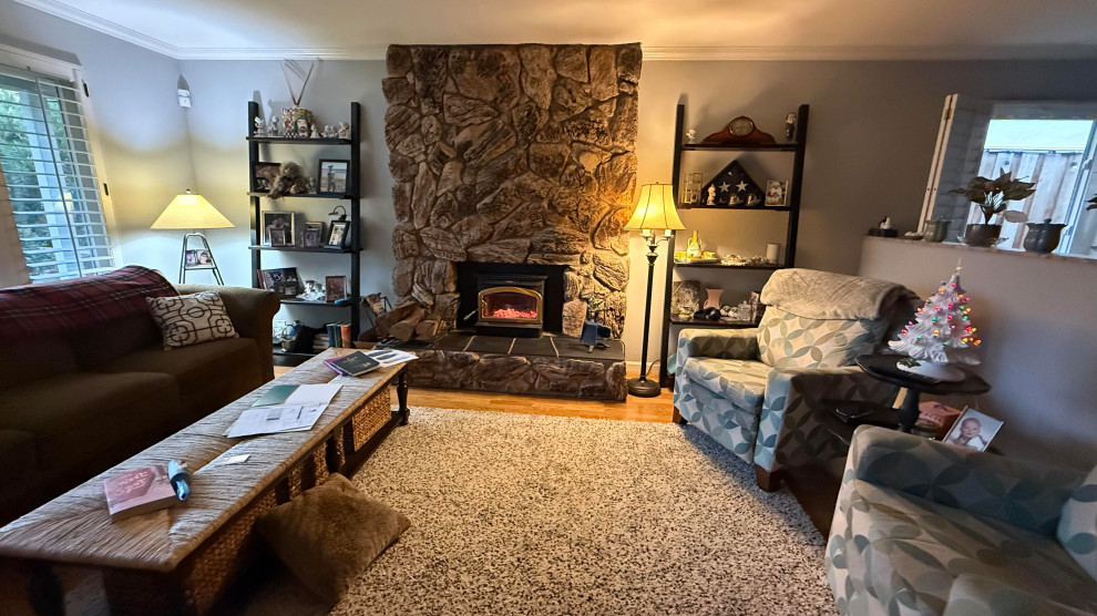 BEFORE: ORIGINAL STONE FIREPLACE & MISMATCHED FURNITURE