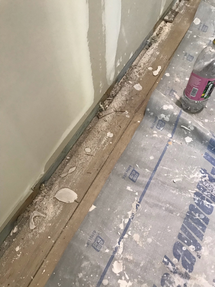 Drywall dust and mud on the vinyl floor