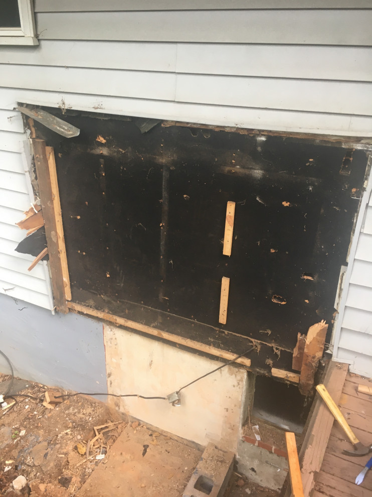 What to put under vinyl siding?