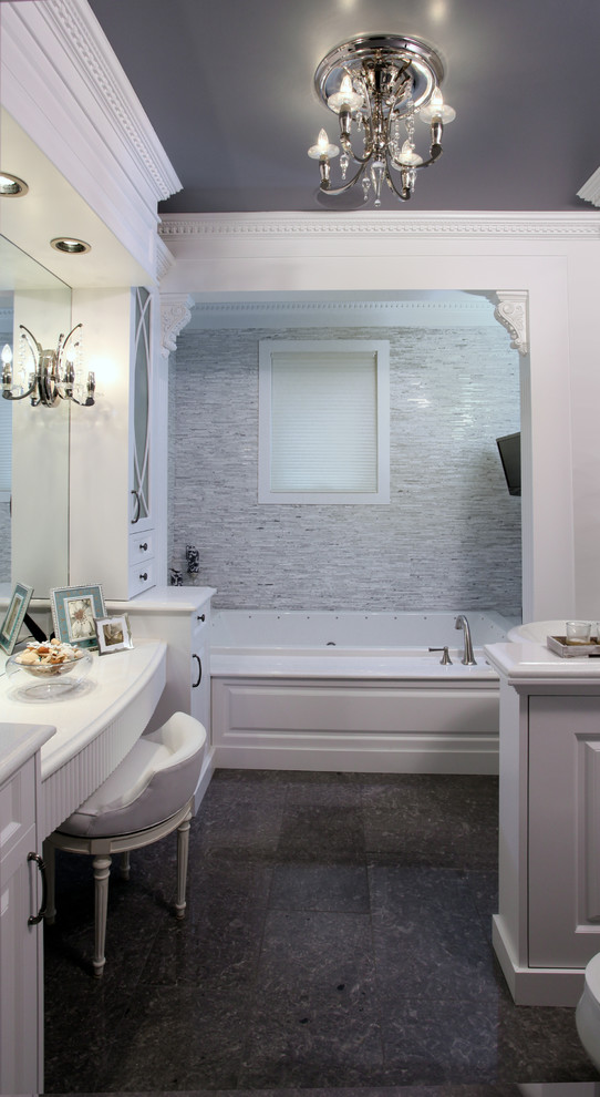 Photo of a large traditional master bathroom in Calgary with raised-panel cabinets, white cabinets, a drop-in tub, gray tile, matchstick tile and grey walls.