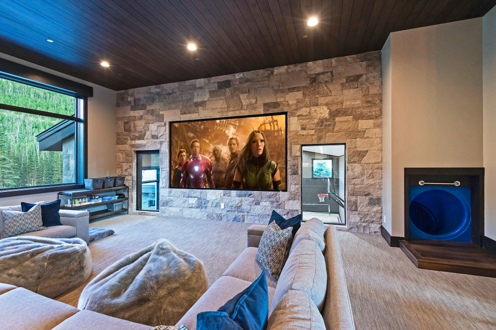 This is an example of a country open concept home theatre in Salt Lake City with grey walls, carpet and grey floor.
