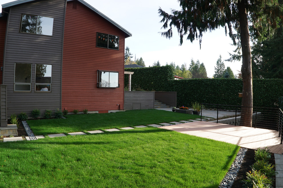 Design ideas for a large modern backyard landscaping in Seattle.