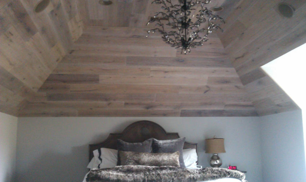 Large modern master bedroom in Bridgeport with beige walls.