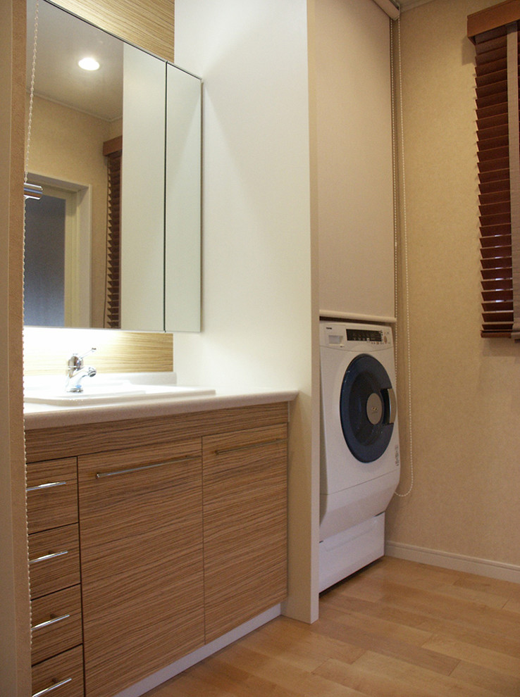 This is an example of an asian laundry room in Other.