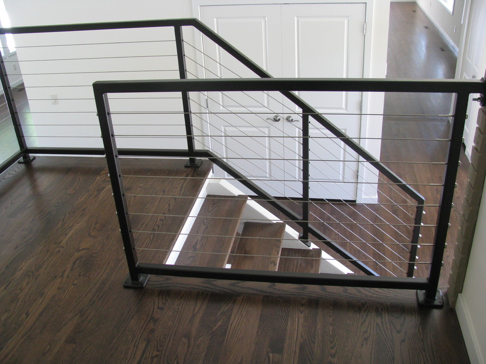 Design ideas for a small modern wood l-shaped staircase in Detroit with open risers and metal railing.