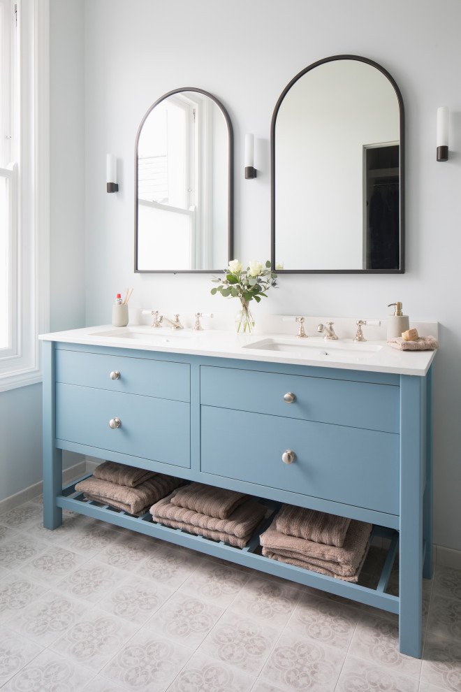 This is an example of a traditional bathroom in Sussex with shaker cabinets and a freestanding vanity.