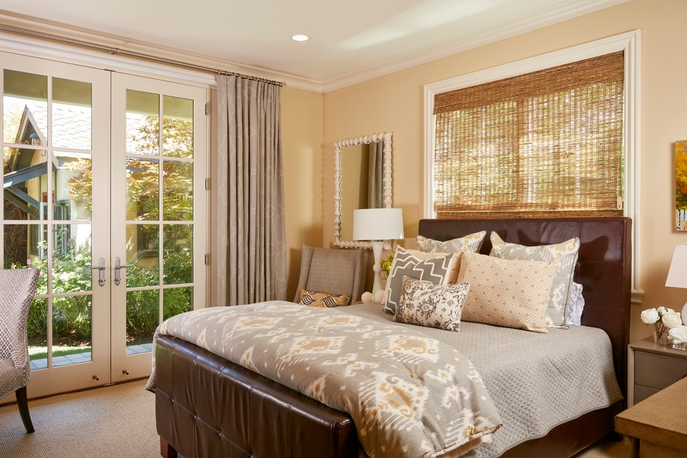 Inspiration for a mid-sized transitional guest bedroom in San Francisco with beige walls and carpet.