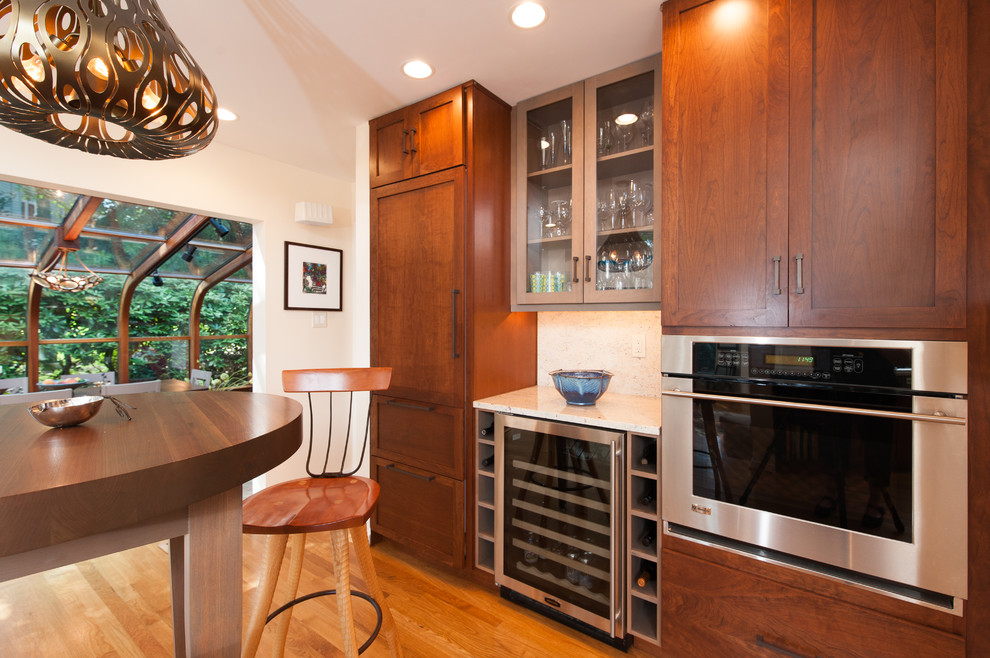 Inspiration for a large transitional kitchen remodel in DC Metro with an undermount sink, shaker cabinets, granite countertops, stainless steel appliances and an island