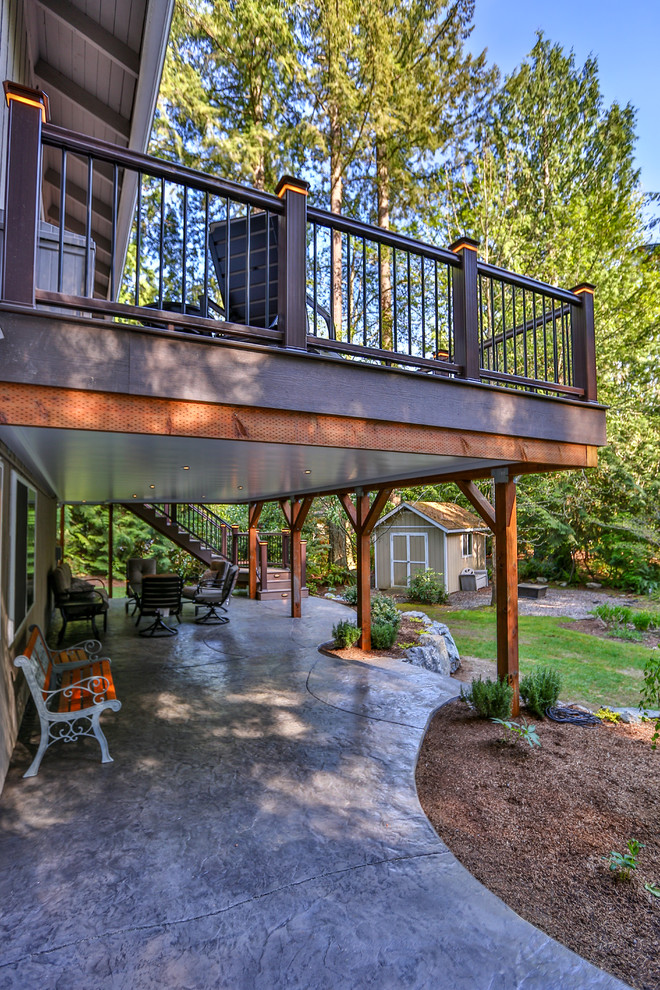 Expansive modern backyard deck in Seattle with no cover.
