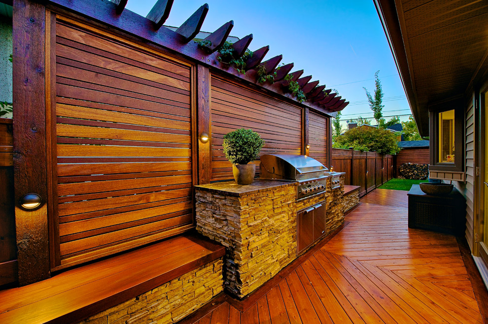 Inspiration for a small traditional backyard deck in Calgary with an outdoor kitchen and no cover.