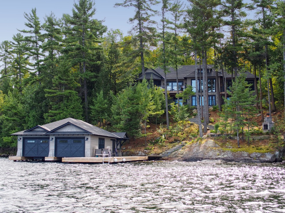 Inspiration for a rustic brown two-story mixed siding house exterior remodel in Toronto with a hip roof and a shingle roof