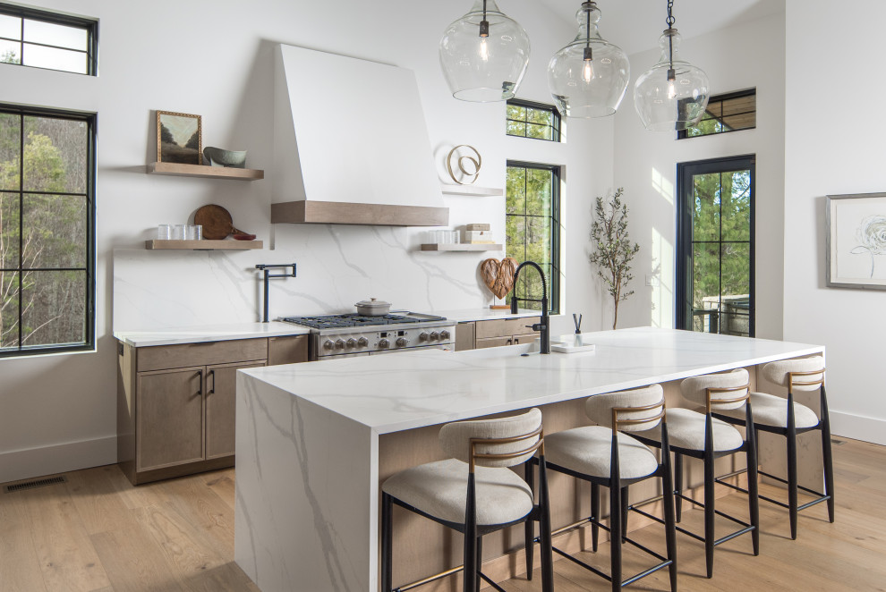 Inspiration for a transitional medium tone wood floor kitchen remodel with a farmhouse sink, quartzite countertops, quartz backsplash and an island