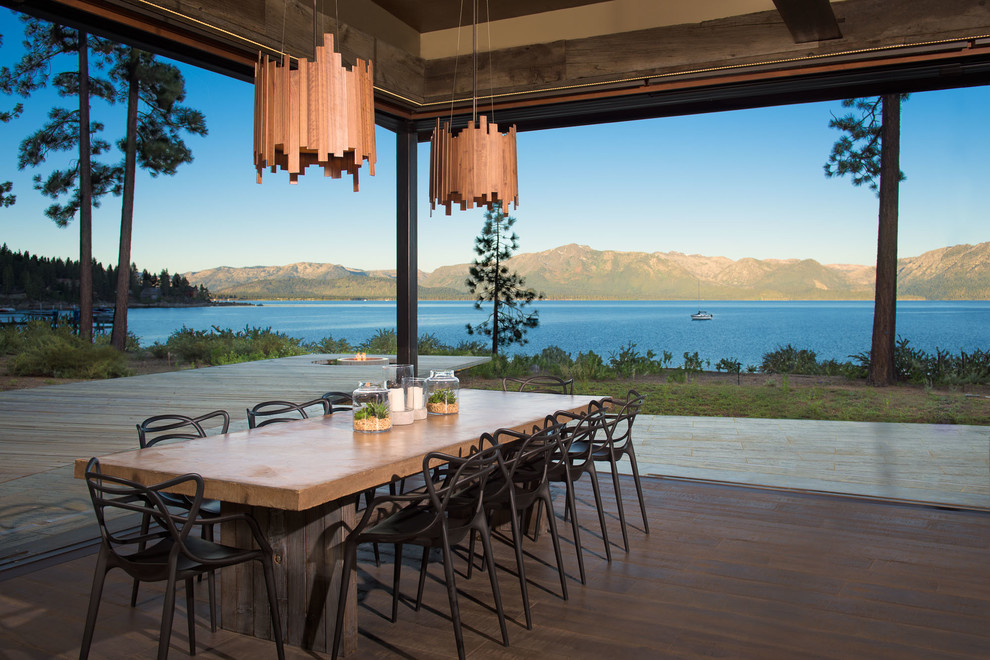 Example of a mountain style dark wood floor dining room design